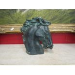 A plaster horses head study signed at base.