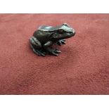 A limited edition bronze frog.