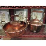 Two copper kettles and a copper twin handled pan