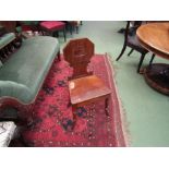 A pair of Victorian mahogany hall chairs on turned outswept legs