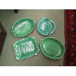 Four Victorian green leaf plates.