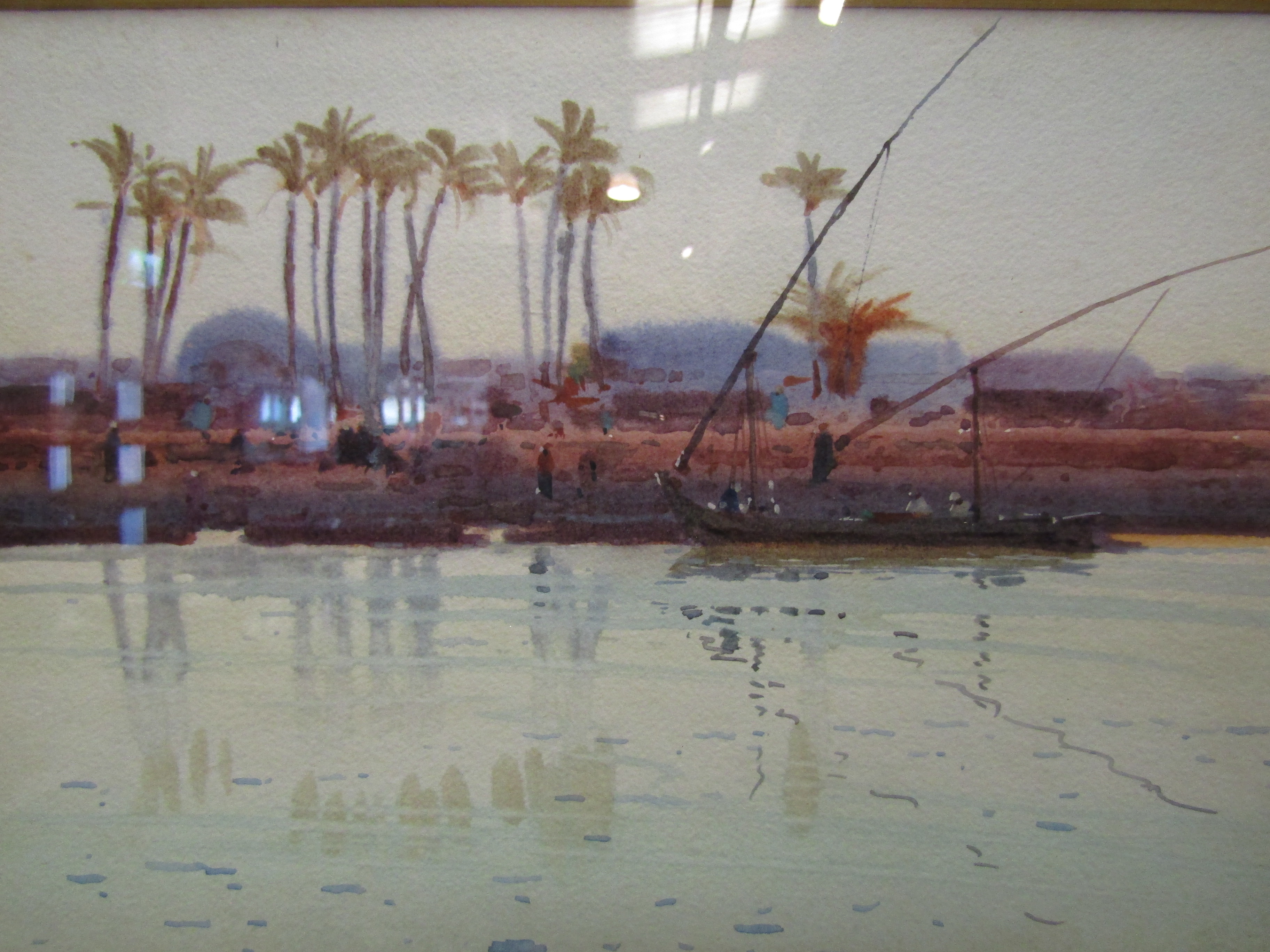 FRANK RICHARDS: Watercolour depicting Egyptian Nile scene, figures, boats and palm trees,