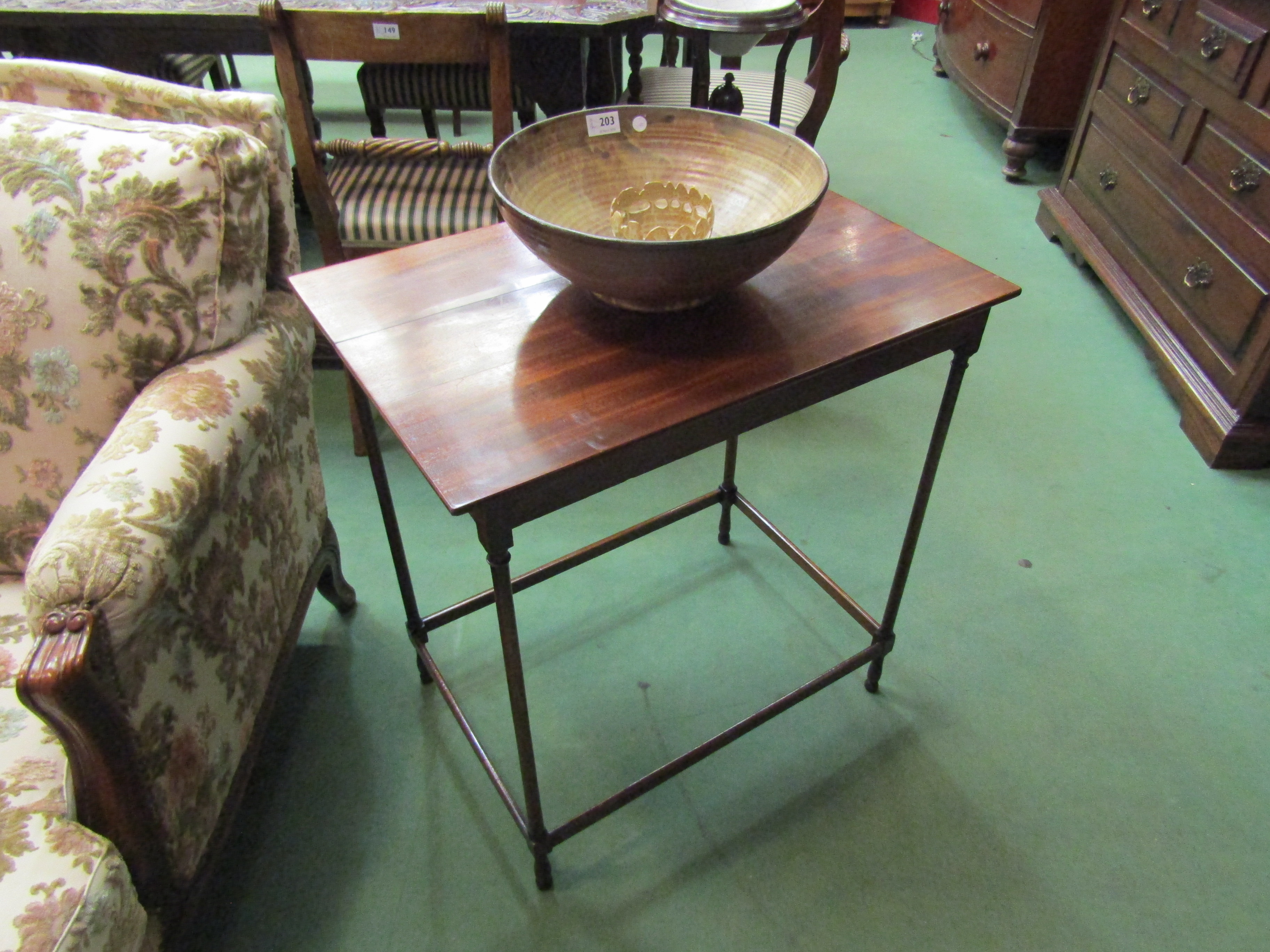 A George III mahogany lamp table the rectangular top on turned fine legs joined by stretchers