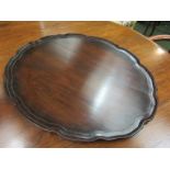 A mahogany wavy edged tray