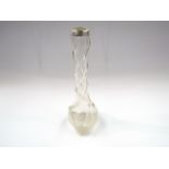 A glass tulip vase with spiral slender neck and silver rim