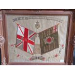 A Devonshire Regiment silkwork, framed and glazed,