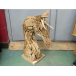 A driftwood sculpture of a horse's head,
