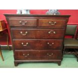 An 18th Century oak chest of two short over three graduating long drawers with brass swan neck