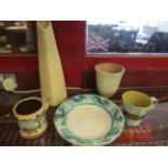 Five pieces of studio pottery including a Kevin Warren slipware mug with fish design