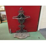 A 20th Century Victorian style cast metal hall umbrella and stick stand with putto design relief