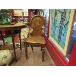 A pair of oak hall chairs, circa 1850,