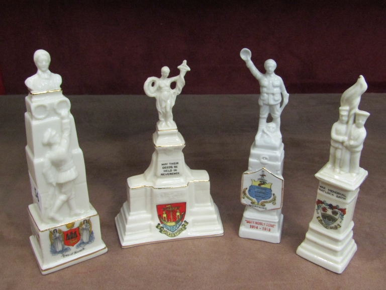 Four crested ware memorial figures including Edith Cavell Arms of Norwich