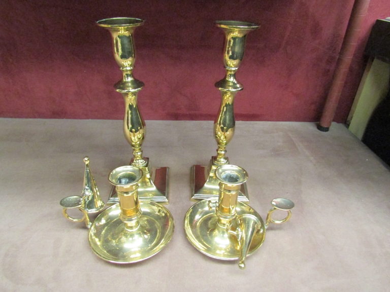 Two pairs of antique brass candlesticks (one pair of ejector and one pair of small chambersticks