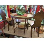 An early 20th Century oval mahogany occasional table with a cross banded top and inlaid surround,