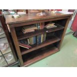 A brass studded leather covered stained pine bookcase