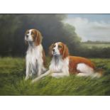 A 20th Century print and oil on canvas depicting two spaniels in field, gilt framed,