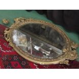 A plaster gilt oval mirror a/f