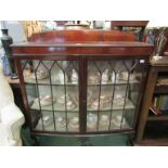 A mahogany glazed two door cabinet,