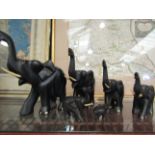 A family of six ebonised elephants