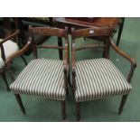 A pair of 19th Century mahogany open arm dining chairs with rope twist backs and green and cream