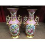 A pair of Victorian Continental porcelain vases, floral panels on gilt-edged pink ground.