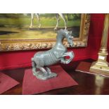 A jade style carved stone figure of rearing horse,