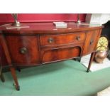 A George III revival crossbanded flame mahogany bow front sideboard the three drawers and single