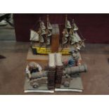 A pair of mixed media pirate design bookends and a pair of tall ship bookends.