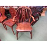 An elm and oak stick back Windsor elbow chair circa 1840 the hoop back with wheel central splat