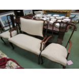 An Edwardian mahogany framed settee and two matching armchairs