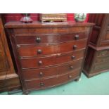 A mahogany bow front chest of two over four graduating drawers,
