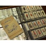 Two albums of Military and other theme cigarette cards including Wills "Recruiting Posters"