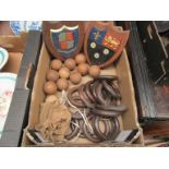A box of wooden curtain rings and plaques etc