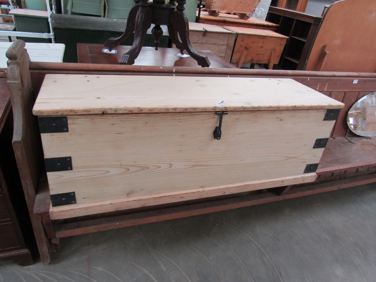 A large Victorian pine box with metal banding and latch 137cm wide
