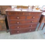 A large Georgian mahogany chest of two over three drawers with a further two secret drawers to top