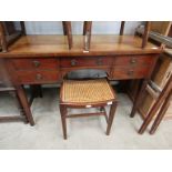 A 19th Century mahogany side table with five frieze drawers, square tapering legs,