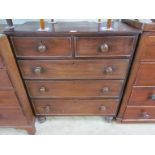 A Victorian mahogany two over three chest of drawers