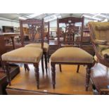 A set of three late Victorian mahogany dining chairs, pierced back splat,