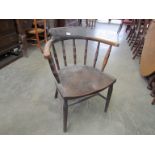 An Edwardian elm seated captains chair