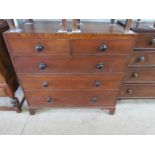 A George III two over three oak chest of drawers