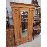 An Edwardian satin wood wardrobe,