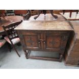 A small 1930's carved oak two door sideboard,