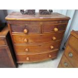 A Victorian mahogany two over three bow front chest of drawers