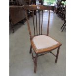 An Edwardian beech bedroom chair