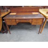 A Georgian Sheraton period inlaid mahogany writing desk with five drawers and brass mushroom shaped