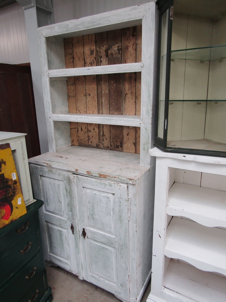 A Continental painted pine two door dresser,