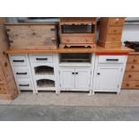 A painted pine kitchen unit in four sections with beech top 73cm x 217cm