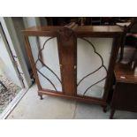 A 1930s walnut glazed two door China cabinet