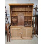 A pine double height kitchen dresser,