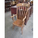 A Victorian elm seated grandfather chair